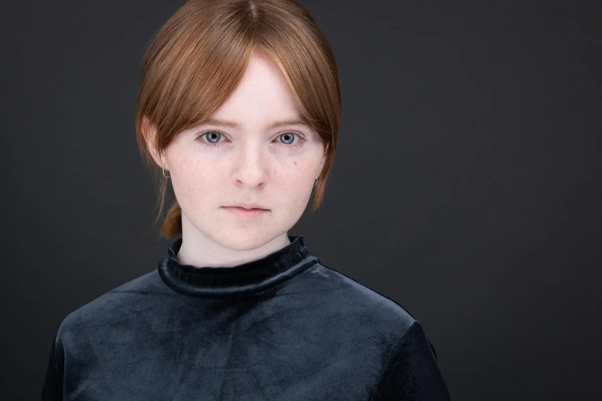 Actor headshot Sydney, young woman on dark background