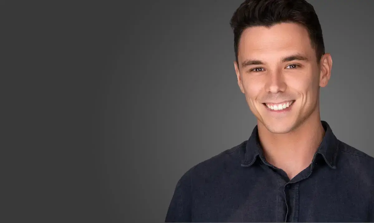 Personal brand headshot Sydney, smiling man in navy shirt