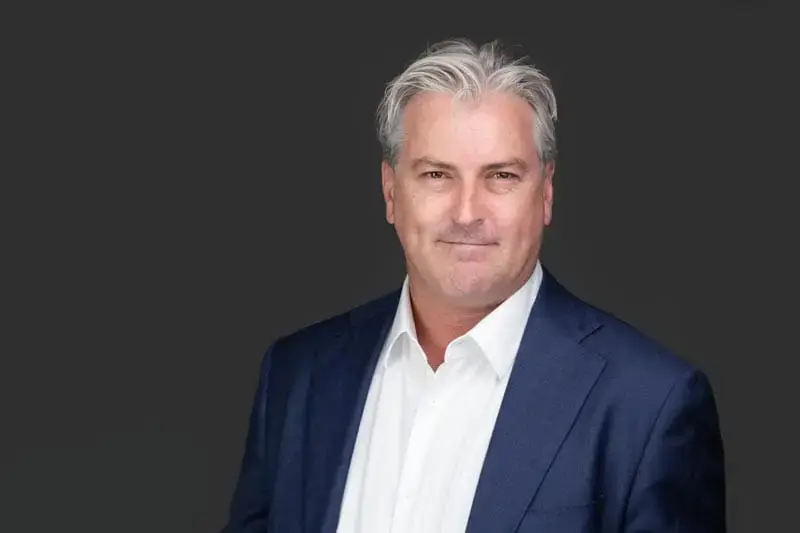 Executive headshot Sydney, man with grey hair in navy suit